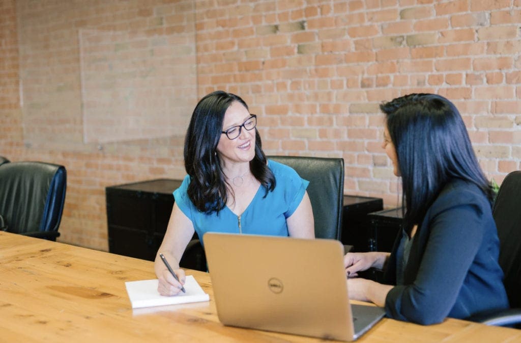 Woman in meeting building client relationships